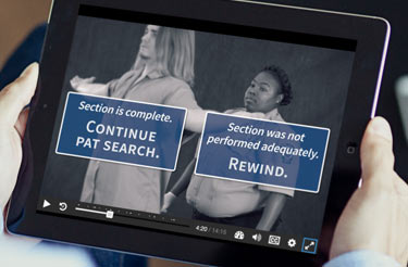 DOJ training video shown on a tablet